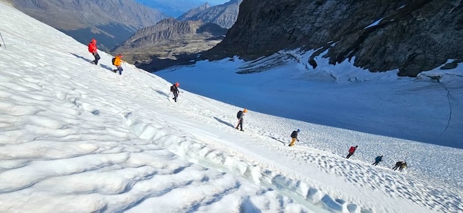 Icicle teams learning glacier travel skills descending Gran Paradiso