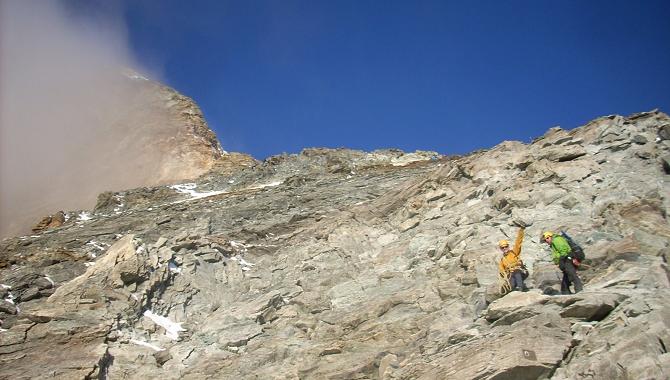 The summit block of the Matterhorn appearing through the cloud