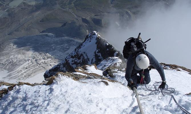 Ascending the fixed ropes above the shoulder of the Matterhorn